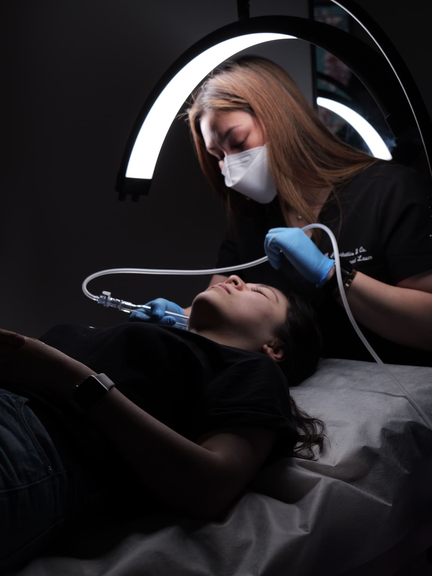 Priscilia treating a client with the Aerolase Neo Elite at PM Aesthetics, Manning